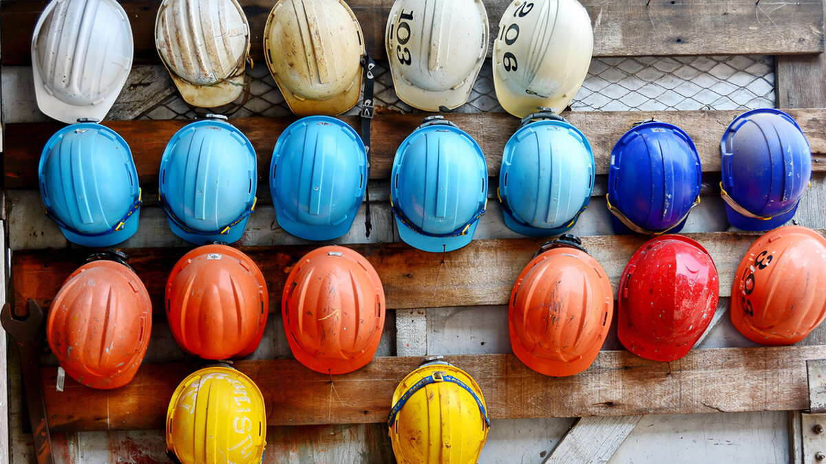 Colorful hard hats in a row