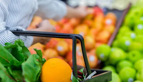 Woman shopping vegetables in store